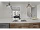 Modern kitchen island with stainless steel sink and pendant lighting at 4419 Splash Trl # 158, Sherrills Ford, NC 28673
