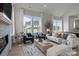 Comfortable living room featuring large windows, a fireplace, and stylish decor at 4419 Splash Trl # 158, Sherrills Ford, NC 28673