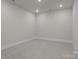 A simple room with recessed lights and neutral carpet provides a blank canvas for versatile use at 4419 Splash Trl # 158, Sherrills Ford, NC 28673