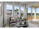 Bright sunroom featuring multiple windows, two chairs and coffee table at 4419 Splash Trl # 158, Sherrills Ford, NC 28673