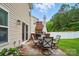 Charming backyard patio with a fireplace, ideal for outdoor entertaining and relaxation at 512 Nanny Point Dr, Monroe, NC 28110