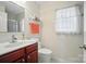 Bright bathroom with a single sink vanity and decorative accents at 512 Nanny Point Dr, Monroe, NC 28110