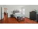 Comfortable bedroom featuring natural light, and hardwood floors at 512 Nanny Point Dr, Monroe, NC 28110