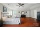 Spacious primary bedroom with vaulted ceiling, hardwood floors, and ample natural light at 512 Nanny Point Dr, Monroe, NC 28110
