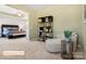 The bedroom sitting area has a comfortable chair, decor, and space to relax at 518 Hullview Vista Vis # 15, Monroe, NC 28110