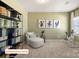 Relaxing bedroom area with a chair, bookshelf, and exercise bike at 518 Hullview Vista Vis # 15, Monroe, NC 28110