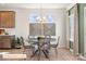 Modern dining room with unique chandelier, art decor, and seating for four at 518 Hullview Vista Vis # 15, Monroe, NC 28110
