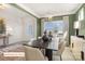 Inviting dining room with stylish lighting, elegant furniture, and a view of the outdoors at 518 Hullview Vista Vis # 15, Monroe, NC 28110