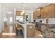 Bright, open kitchen with a large island, stainless steel appliances, and stylish pendant lighting at 518 Hullview Vista Vis # 15, Monroe, NC 28110