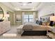 The main bedroom has tray ceilings, neutral decor, and a large window at 518 Hullview Vista Vis # 15, Monroe, NC 28110