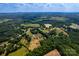 Aerial view of a home and surrounding area including vast farmlands and natural foliage at 5258 E Bandys Cross Rd, Catawba, NC 28609