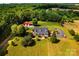 Aerial view of home on expansive lot with mature trees and a large detached garage at 5258 E Bandys Cross Rd, Catawba, NC 28609