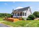 This backyard features a spacious deck, screened-in porch and manicured lawn at 5258 E Bandys Cross Rd, Catawba, NC 28609