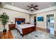 Cozy bedroom with hardwood floors, a ceiling fan and an ensuite bathroom at 5258 E Bandys Cross Rd, Catawba, NC 28609