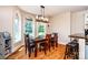Charming dining room with hardwood floors, and a farmhouse-style chandelier at 5258 E Bandys Cross Rd, Catawba, NC 28609
