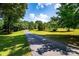 Long, paved driveway leading to a serene and tree-lined property at 5258 E Bandys Cross Rd, Catawba, NC 28609
