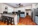 Well-lit kitchen featuring white cabinetry, dark countertops, and a breakfast bar with stools at 5258 E Bandys Cross Rd, Catawba, NC 28609