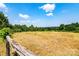 A fenced in pasture with a treeline in the background at 5258 E Bandys Cross Rd, Catawba, NC 28609