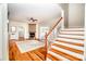 Spacious living room with hardwood floors, fireplace, staircase, and lots of natural light at 5258 E Bandys Cross Rd, Catawba, NC 28609