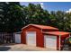 Three-car outbuilding with a red roof provides extra space for parking and storage at 5258 E Bandys Cross Rd, Catawba, NC 28609