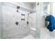 Beautifully tiled shower with multiple shower heads, a built-in niche, and a glass door at 5258 E Bandys Cross Rd, Catawba, NC 28609
