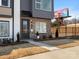Modern townhome exterior features a brick facade, sleek black accents, and professional landscaping at 5508 Swaling St, Charlotte, NC 28217
