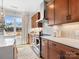 Kitchen features modern appliances, stainless steel vent hood, natural light, and wooden cabinetry at 5508 Swaling St, Charlotte, NC 28217