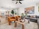 Open-concept space showcasing modern seating, stylish decor, and adjacent dining area with bright light at 5508 Swaling St, Charlotte, NC 28217