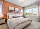 A primary bedroom suite boasts natural light, stylish wallpaper, and elegant decorative touches at 5508 Swaling St, Charlotte, NC 28217