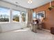 Bright office space with a natural-wood desk, neutral walls, lots of light, and serene outdoor views at 5508 Swaling St, Charlotte, NC 28217