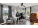 Bright bedroom featuring high ceilings, an elevated bed and desk setup, and natural light at 5517 Alexa Rd, Charlotte, NC 28277