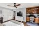 Bedroom with hardwood floors, a ceiling fan, and a classic desk and shelving at 5517 Alexa Rd, Charlotte, NC 28277