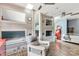Large bedroom featuring custom built-in bunkbeds, wood floors, ceiling fans, and seating area at 5517 Alexa Rd, Charlotte, NC 28277