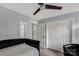 Cozy bedroom featuring a ceiling fan, tile flooring, and bright white trim at 5517 Alexa Rd, Charlotte, NC 28277