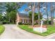View of brick home, driveway, manicured lawn and a red mailbox with the house number 5517, creating a welcoming curb appeal at 5517 Alexa Rd, Charlotte, NC 28277