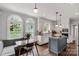 Bright kitchen with stainless appliances, island cooktop, and a dining nook overlooking the yard at 5517 Alexa Rd, Charlotte, NC 28277