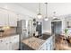 Modern kitchen with granite countertops, stainless steel appliances, and custom cabinetry at 5517 Alexa Rd, Charlotte, NC 28277