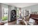 Elegant living room with hardwood floors, comfortable seating, and large windows that bring in natural light at 5517 Alexa Rd, Charlotte, NC 28277