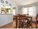 Cozy dining area with a wooden table set, next to an open layout concept at 5629 Ruth Dr, Charlotte, NC 28215