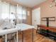 Comfortable spare room with hardwood floors, complemented by natural light and a view of the backyard at 5629 Ruth Dr, Charlotte, NC 28215