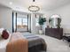 Inviting bedroom with large windows, modern lighting, and neutral decor at 5731 Castlerea Dr, Charlotte, NC 28217