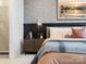 Cozy bedroom with textured wall, modern lighting, and comfortable furnishings at 5731 Castlerea Dr, Charlotte, NC 28217