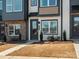 Charming townhome exterior with modern design and well-maintained landscaping at 5731 Castlerea Dr, Charlotte, NC 28217