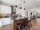 Contemporary kitchen with island, bar seating, stainless steel appliances, and pendant lighting at 5731 Castlerea Dr, Charlotte, NC 28217