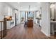 Modern kitchen with stainless steel appliances, island, and a view of the deck at 5731 Castlerea Dr, Charlotte, NC 28217