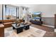 Cozy living room featuring modern furniture, a flat-screen TV, and elegant decor at 5731 Castlerea Dr, Charlotte, NC 28217