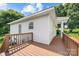 Wood back deck that offers a relaxing outdoor space with trees at 613 Church St, Belmont, NC 28012