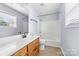 Bathroom featuring neutral walls, vanity, mirror and shower-tub combo at 613 Church St, Belmont, NC 28012