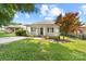 Charming single-story home featuring a welcoming front porch, landscaped yard, and a freshly paved driveway at 613 Church St, Belmont, NC 28012