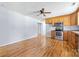 Functional kitchen area showcasing wood cabinets, stainless steel appliances, and ample space for dining and cooking at 613 Church St, Belmont, NC 28012